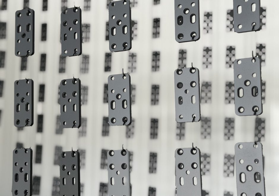 Hang line loaded with repeat hardware parts for powder coating